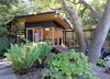 Modern home with Horizontal Fences, Wall, Living Space Room Type, and Kitchen. The Shudio from the fire pit area with Seth at the door. Photo 6 of The Shudio