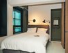 Modern home with Bed, Wardrobe, Storage, Floor Lighting, Ceiling Lighting, Wall Lighting, Lamps, Living Room, and Concrete Floor. Bedroom Photo 6 of HUT
