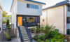 Modern home with Outdoor, Garden, Flowers, Front Yard, Walkways, Vegetables, Raised Planters, Gardens, Wood Fences, Wall, Metal Fences, Wall, and Horizontal Fences, Wall. Front Entrance Photo of East Pender home