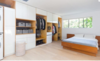 Modern home with Bedroom, Bed, Bookcase, Storage, Shelves, Ceiling Lighting, Recessed Lighting, and Light Hardwood Floor. Master Bedroom Photo 8 of East Pender home
