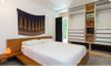 Modern home with Bedroom, Storage, Bed, Night Stands, Shelves, Lamps, Recessed Lighting, Ceiling Lighting, Accent Lighting, and Concrete Floor. Lower Suite Bedroom Photo 12 of East Pender home