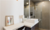 Modern home with Bath Room, Vessel Sink, Open Shower, Concrete Floor, Corner Shower, Full Shower, Recessed Lighting, Glass Tile Wall, Ceiling Lighting, Table Lighting, and One Piece Toilet. Lower Suite Bathroom Photo 16 of East Pender home