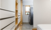 Modern home with Laundry Room, White Cabinet, and Stacked. Lower Suite Laundry Photo 17 of East Pender home