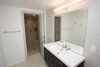 Modern home with Bath Room, Full Shower, Porcelain Tile Floor, Enclosed Shower, Ceiling Lighting, Recessed Lighting, Wall Lighting, Ceramic Tile Wall, and One Piece Toilet. Bathroom on third level Photo 7 of House in the Trees