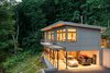 Modern home with Exterior, House Building Type, Metal Roof Material, and Concrete Siding Material. Exterior uses a neutral color palette with modern and clean lines. Photo of Craven Gap Residence