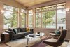 Modern home with Living Room, Chair, Sofa, Coffee Tables, Console Tables, Wall Lighting, and Light Hardwood Floor. The living room view offers a view of the train trestle over Fontana Lake. Photo 3 of Fontana Lake House