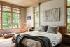 Modern home with Bedroom, Bed, Chair, Night Stands, Table Lighting, and Light Hardwood Floor. A neutral color palette in the bedroom creates a soothing and relaxing atmosphere. Photo 6 of Fontana Lake House