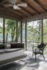 Modern home with Living Room, Bench, Chair, Sofa, and Ceiling Lighting. The screen porch is located off the main level and is an extension of the main living space. Photo 7 of Fontana Lake House