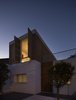 Modern home with Outdoor, Trees, Vegetables, Gardens, Front Yard, Walkways, Small Patio, Porch, Deck, Vertical Fences, Wall, Wood Fences, Wall, and Post Lighting. Facade Photo 8 of Casa Plaza