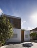 Modern home with Outdoor, Front Yard, Trees, Walkways, Small Patio, Porch, Deck, Vegetables, Flowers, Gardens, Wood Patio, Porch, Deck, Concrete Patio, Porch, Deck, Wood Fences, Wall, and Tile Patio, Porch, Deck. Facade Photo of Casa Plaza