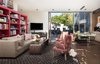 Modern home with Living Room, Chair, Sofa, Ceiling Lighting, and Bookcase. Family Room Photo 12 of The OneTaste Residence