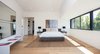 Modern home with Bedroom, Ceiling Lighting, Medium Hardwood Floor, and Bed. Master Bedroom Photo 7 of The Kilkea House