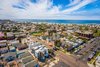 Modern home with Outdoor, Rooftop, Front Yard, Trees, Hardscapes, Small Patio, Porch, Deck, Walkways, Landscape Lighting, Decking Patio, Porch, Deck, and Horizontal Fences, Wall. Three fee simple homes a block from the beach. Photo of Three on Abbott