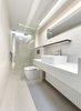 Modern home with Bath Room, Tile Counter, Porcelain Tile Floor, Vessel Sink, Open Shower, Ceiling Lighting, Accent Lighting, Pendant Lighting, Porcelain Tile Wall, One Piece Toilet, and Recessed Lighting. Bathroom Photo 5 of Curtain Cottage