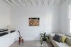 Modern home with Living Room, Sofa, Coffee Tables, Console Tables, Light Hardwood Floor, and Table Lighting. Front Living Room Photo 7 of Curtain Cottage