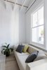 Modern home with Living Room, Sofa, Coffee Tables, and Light Hardwood Floor. Living Room Detail Photo 8 of Curtain Cottage