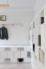 Modern home with Shelves Storage Type, Shelves, Storage, Bookcase, Pendant Lighting, Light Hardwood Floor, and Bedroom. Bedroom cabinetry Photo 11 of Curtain Cottage