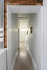 Modern home with Light Hardwood Floor, Kitchen, and Engineered Quartz Counter. Threshold Photo 14 of Curtain Cottage
