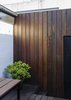 Modern home with Outdoor, Back Yard, Shrubs, Small Patio, Porch, Deck, Hardscapes, Gardens, Decking Patio, Porch, Deck, Planters Patio, Porch, Deck, Wood Fences, Wall, and Wood Patio, Porch, Deck. Courtyard wall detail Photo 20 of Curtain Cottage