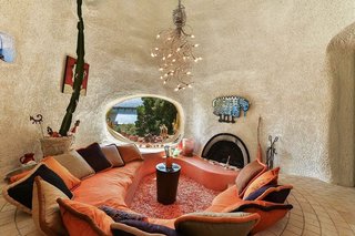 The home's interior, pictured prior to its sale to Fang, reflects its curvaceous, concrete exterior.