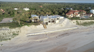 The Milam family installed a new retaining wall along the beach outside the home. 