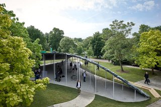 Slim white columns designed to resemble trees hold up the heavy slate roof.