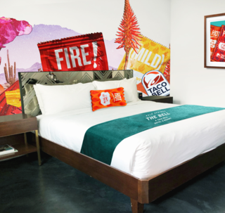 Hot sauce pillows and wall decor await guests for four nights in August at The Bell, Taco Bell's first hotel experience in Palm Springs, California.