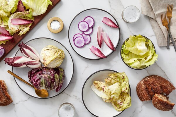 Colorful food on simple, textured plates provides a perfect lunchtime palette.