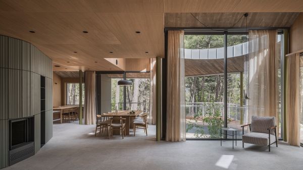 The home's open-plan living area is heated in winter by a wood-burning fireplace and radiant-heated ceramic flooring. The floors cool in the summer months and, along with natural ventilation from the home's many windows, mean the house doesn't require air conditioning.