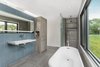 Modern home with Bath Room, Freestanding Tub, Ceramic Tile Floor, Slate Floor, Wall Mount Sink, Glass Tile Wall, Open Shower, and Ceiling Lighting. The modern bathroom with an open shower and simple tile. Photo 7 of Copperwood