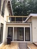 Modern home with Exterior, Metal, Sliding Door Type, Outdoor, Rooftop, and Wood Patio, Porch, Deck. Access to the deck and the Master Bedroom roof deck above Photo 2 of The Gugs House
