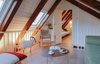 Modern home with Living Room, Chair, Medium Hardwood Floor, Coffee Tables, and Accent Lighting. Upper living room and refugee bed room Photo 3 of From intimicy to social: a weekend apartment in the mountains