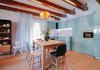 Modern home with Dining Room, Table, Chair, Lamps, Pendant Lighting, Accent Lighting, and Medium Hardwood Floor. Dinning room with Disa pendant lamp by Josep Antoni Coderch Photo 2 of From intimicy to social: a weekend apartment in the mountains