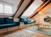 Modern home with Living Room, Lamps, Hanging Fireplace, Sofa, Medium Hardwood Floor, and Floor Lighting. Custom made living room sofa, able to host two extra guest Photo of From intimicy to social: a weekend apartment in the mountains