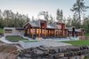 Modern home with Outdoor, Large Patio, Porch, Deck, Decking Patio, Porch, Deck, Wood Patio, Porch, Deck, Metal Patio, Porch, Deck, Walkways, Front Yard, Raised Planters, and Boulders. Exterior Photo 3 of Timberidge