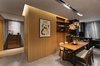 Modern home with Kitchen, Marble Counter, Laminate Cabinet, Marble Floor, Glass Tile Backsplashe, Ceiling Lighting, Pendant Lighting, Refrigerator, Wall Oven, Ice Maker, Microwave, Beverage Center, and Drop In Sink. The large areas of black enameled glass reflect and extend the kitchen's sense of space.
Under the light of the exquisitely-shaped glass lamps, the house's owner can enjoy blissful moments alone, or gather some good friends and drink until morning.
Photo 10 of During the strolling