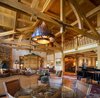 Modern home with Living Room, Chair, Sofa, Console Tables, Ceiling Lighting, Medium Hardwood Floor, Corner Fireplace, and Gas Burning Fireplace. Great Room Photo 2 of Ultimate Western Farmhouse