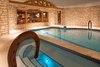 Modern home with Living Room. Indoor Grotto Style Pool Photo 7 of Ultimate Western Farmhouse