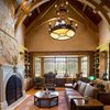 Modern home with Office, Desk, Library Room Type, Medium Hardwood Floor, Shelves, Chair, and Lamps. Library Photo 5 of Ultimate Western Farmhouse