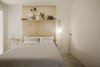 Modern home with Bedroom, Bed, Shelves, Bookcase, Pendant Lighting, and Concrete Floor. Bedroom Photo of Narvarte Terrace