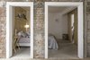 Modern home with Bedroom, Brick Floor, Concrete Floor, Bed, Bookcase, Shelves, and Pendant Lighting. Bedroom view from the hallway Photo 2 of Narvarte Terrace