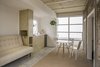 Modern home with Wood Cabinet, Wood Counter, Brick Floor, Concrete Floor, Ceiling Lighting, Refrigerator, Drop In Sink, Sofa, Dining Room, Chair, and Table. Kitchen / living / dining Photo 8 of Narvarte Terrace