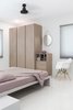 Modern home with Bedroom, Bed, Ceiling Lighting, Chair, and Wardrobe. Linen Tales from Lithuania makes any room cozy with their natural linen in muted pastel tones. The hanging mirror by Hay is a playful and modern take on the classic strap mirror and blends with any theme. The Folded Vase by Amanda Betz for Menu atop the side drawers, admired unadorned for its raw beauty and earthy pastel clay. Photo 10 of Living in Monochrome, far away from Nordic lands