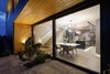 Modern home with Exterior, Concrete Siding Material, House Building Type, Wood Siding Material, Stone Siding Material, and Gable RoofLine. Dinning room view from the terrace Photo 10 of BLACK ROCK