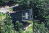 Modern home with Outdoor, Trees, Grass, Walkways, Front Yard, Decking Patio, Porch, Deck, Large Patio, Porch, Deck, and Wood Patio, Porch, Deck. The Angle House Photo 11 of The Angle House