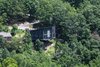 Modern home with Outdoor, Front Yard, Trees, Grass, Shrubs, Large Patio, Porch, Deck, and Decking Patio, Porch, Deck. The Angle House Photo 13 of The Angle House