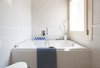 Modern home with Bath Room, Porcelain Tile Floor, Ceramic Tile Wall, and One Piece Toilet. bathroom Photo 8 of House PB