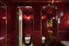 Modern home with Bath Room, One Piece Toilet, and Ceramic Tile Wall. Adjacent to the restaurant and bar on the ground floor is a long, narrow corridor that leads to the concierge. Photo 9 of The Fleming Hotel