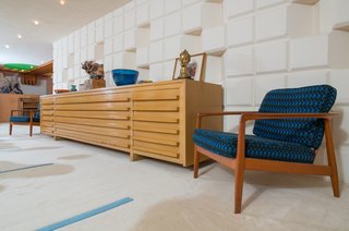 A Midcentury Time Capsule Captures an Architect's Love For Iconic Design - Photo 8 of 14 - Midcentury modern lounge chairs flank the Herman Miller buffet table that Dow designed himself.