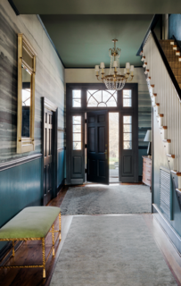 The walls throughout The Clifton were painted in Farrow & Ball’s Stone Blue, and the trim was gussied up with the complementary shade of Stiffkey Blue by Farrow & Ball. 